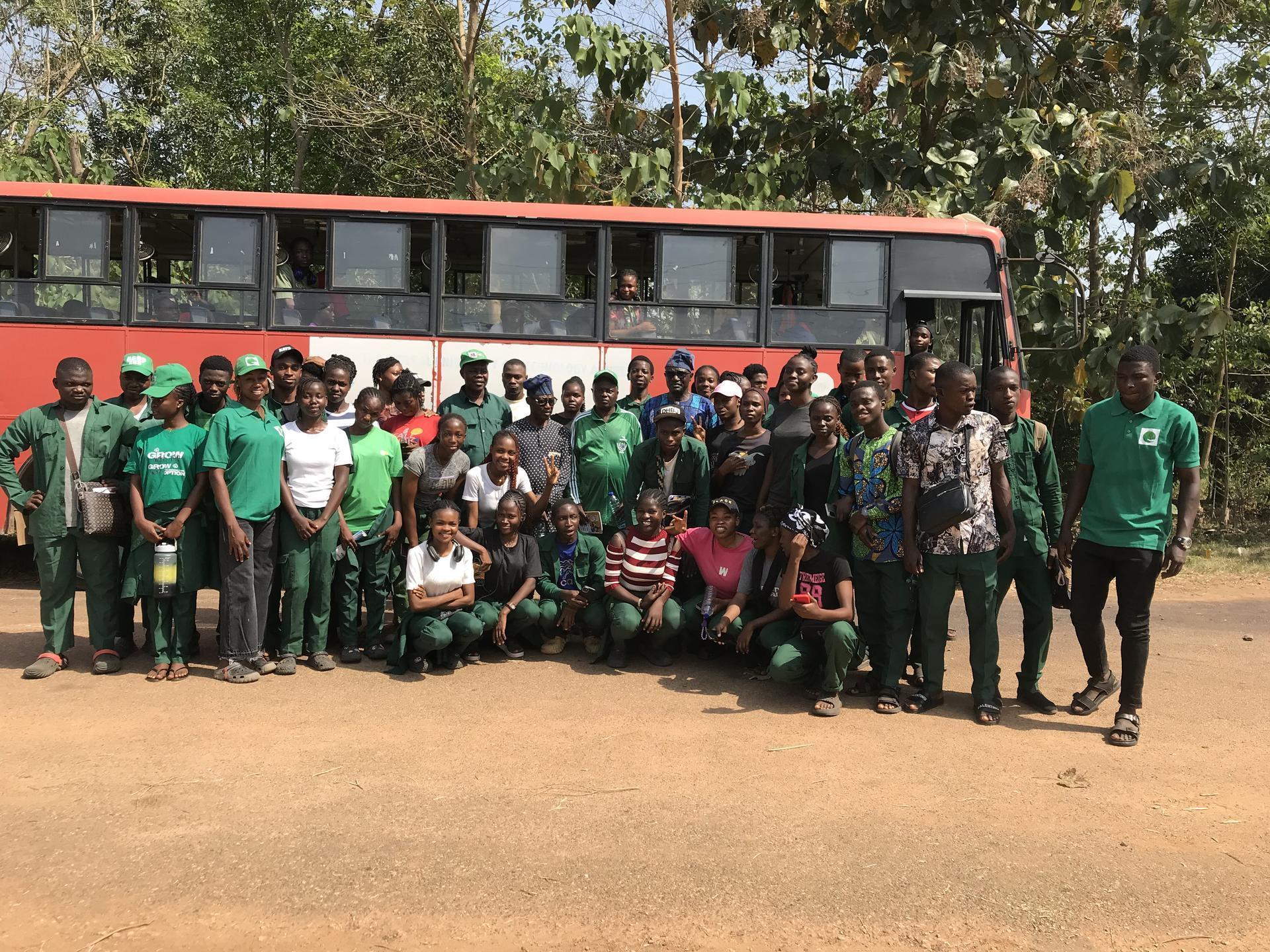 GADEF students group photo by field trip bus