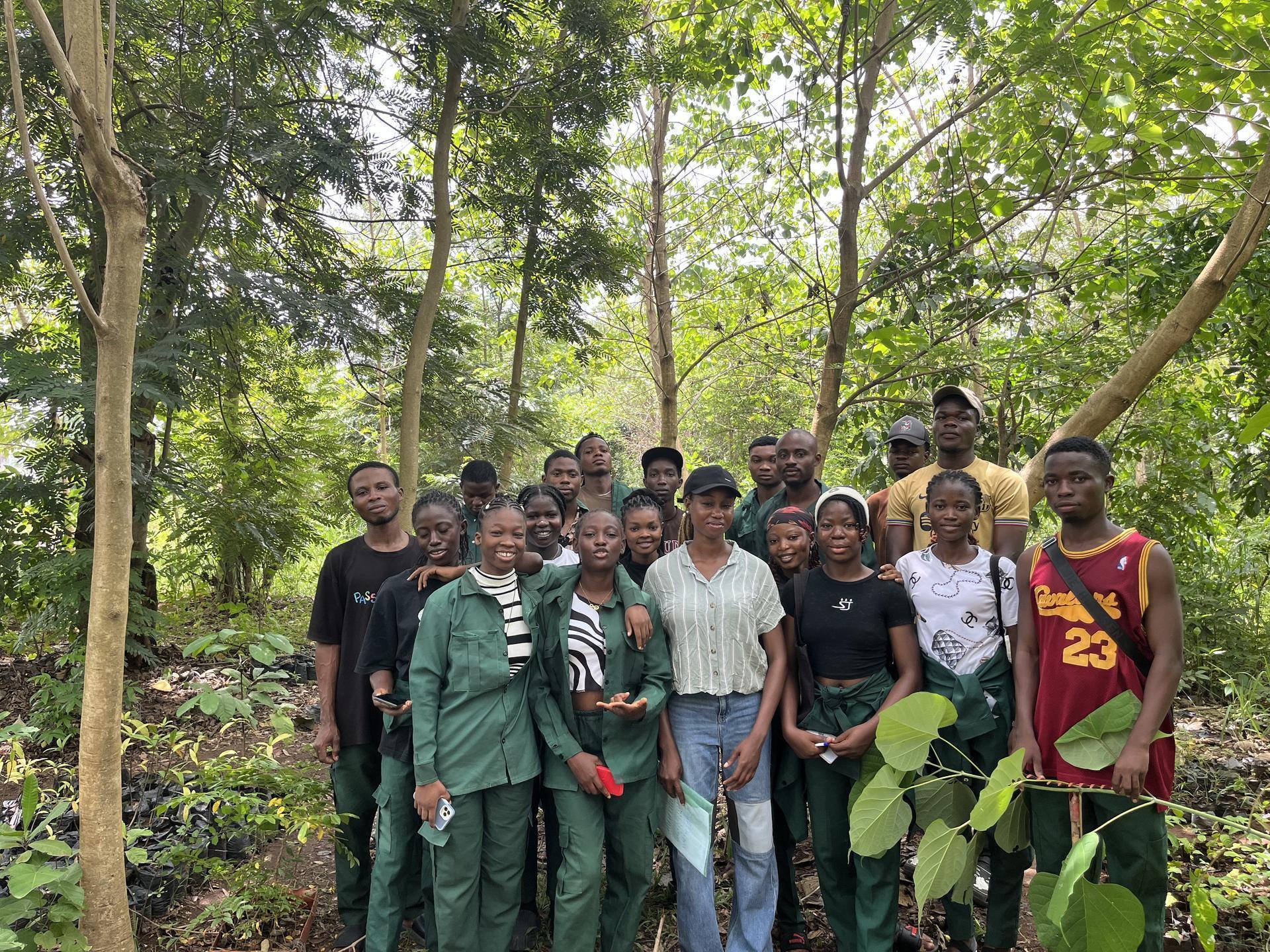 GADEF team with vision banner in dense forest